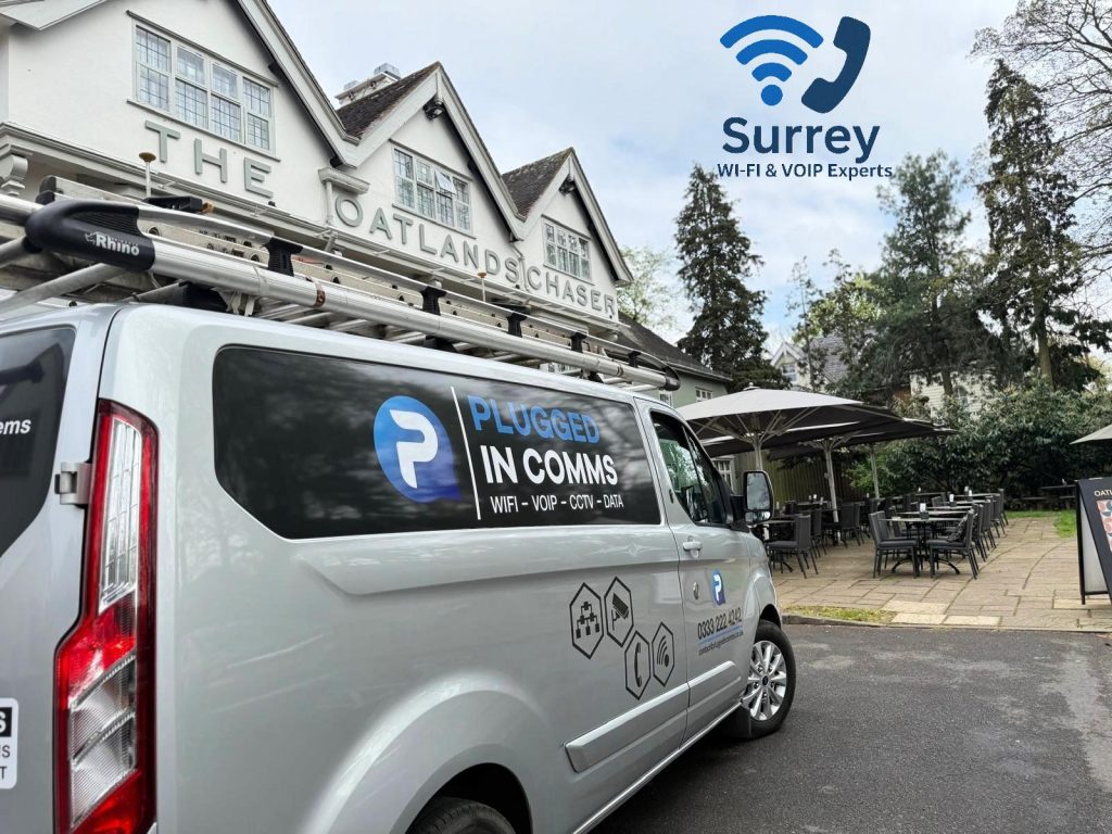 van parked outside The Oatlands Chaser pub in Weybridge, delivering expert Wi-Fi and VoIP services to local businesses.